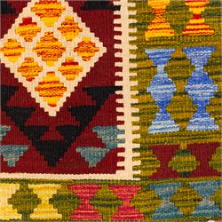 Afghan Maimana flatweave kilim, central crimson field features a large bold nested diamond motif and stylized geometric lozenge patterns on olive purple, blue, yellow and green tone ground, border stripe in teal ground, and fringe