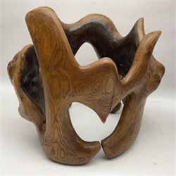 Helen Skelton (British 1933 – 2023): Two carved wooden abstract sculptures, one modelled as a entwined knot, largest H48cm. Born into an RAF family in 1933 in Kent and travelled the world extensively during her childhood. After settling in Bridlington, Helen immersed herself in painting, textiles, and wood sculpture, often inspired by nature's beauty. Her talent was showcased in a one-woman show at Sewerby Hall and recognised with the sculpture prize at Ferens Art Gallery in 2000. Sadly, Helen’s daughter passed away from cancer in 2005. This loss inspired Helen to donate her sculptures to Marie Curie upon her passing in 2023.