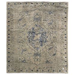 Persian grey and indigo ground carpet, shaped central medallion surrounded by swept and curling leafy branches, the border decorated with stylised plant motifs