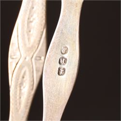 Early 19th century silver caddy spoon, Elizabeth II caddy spoon, various silver condiment spoons, sugar tongs, napkin ring, other silver cutlery and a silver paper knife, boxed