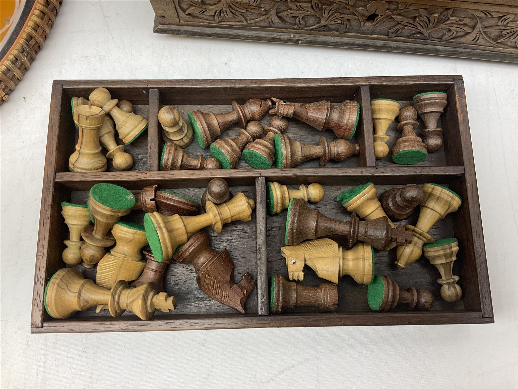 Two Scott-Ford framed silhouettes, featuring the standing profile study of a man dated 1929 and a pair of women dated 1929 and 1930, together with a box containing wooden chess pieces and a serving tray 