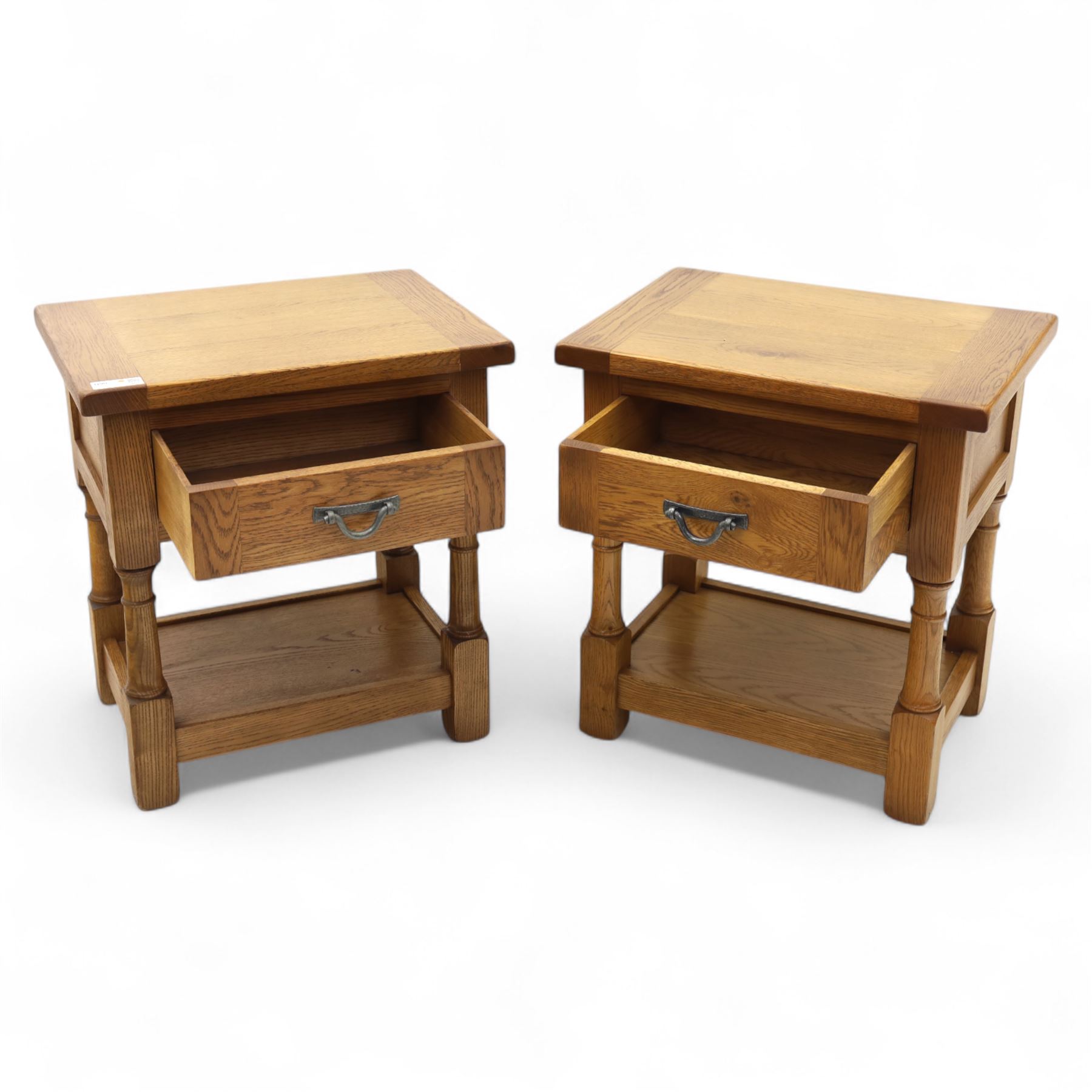 Old Charm - ‘Chatsworth’ pair of light oak lamp tables, each with moulded rectangular top, single drawer and metal drop handle, raised on turned supports joined by undertier shelves