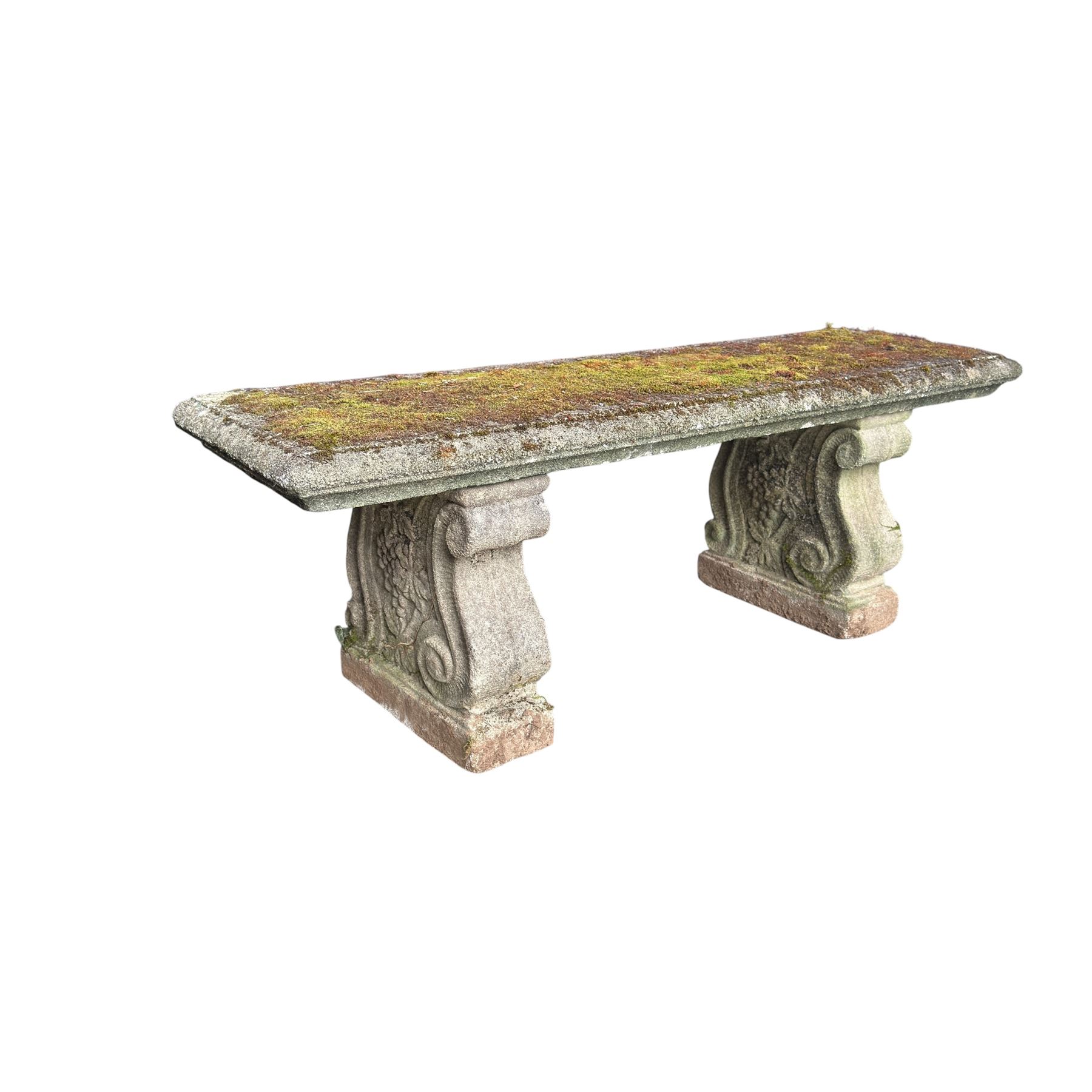 Weathered cast stone three piece bench, the rectangular seat with moulded edge, raised on Neoclassical style end supports with S-scrolls and fruiting grapevines, on rectangular bases