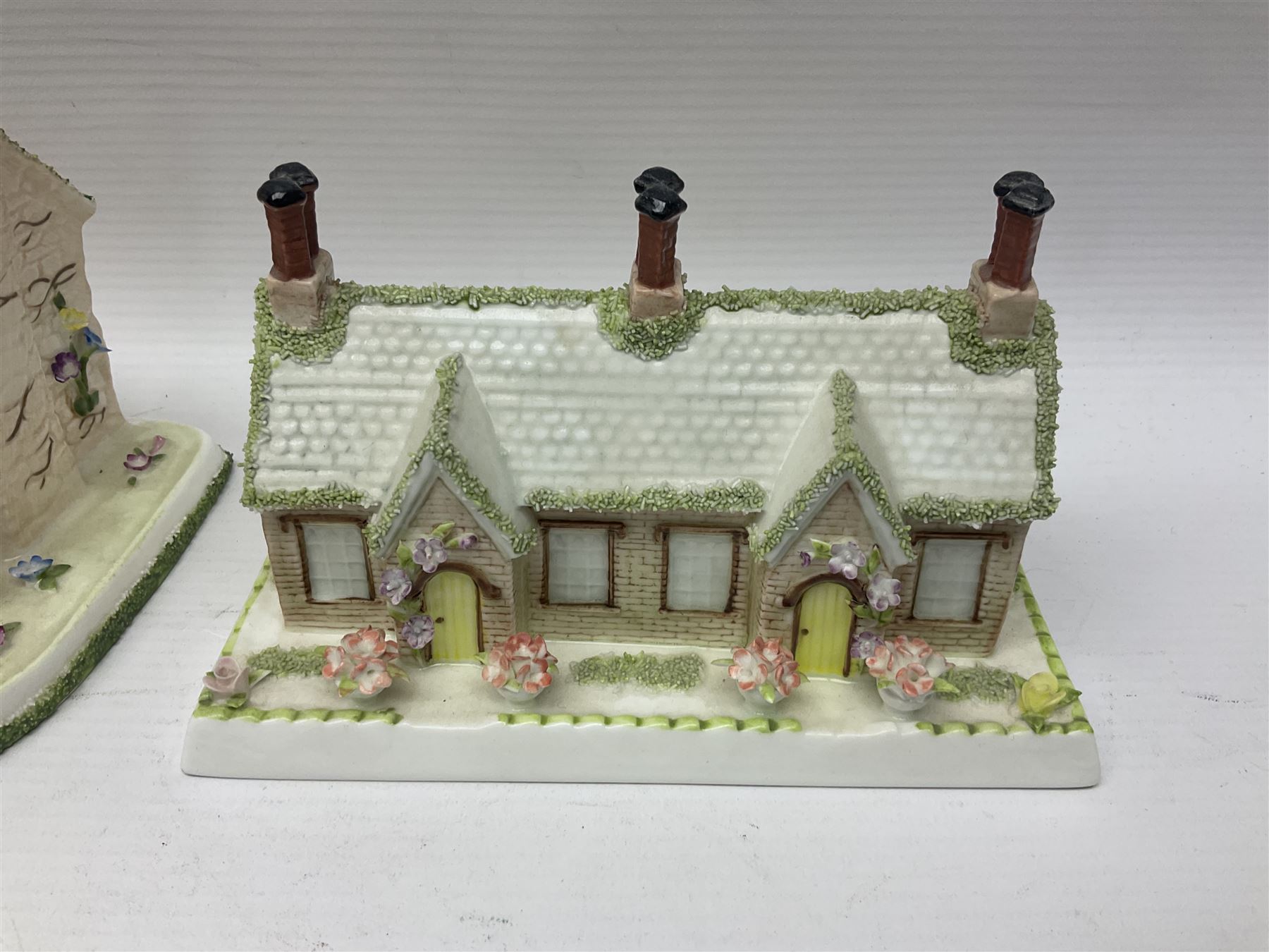 Eleven Coalport cottages, including Park Folly, The Alms House, Watermill and The Summer House, each with printed marks beneath