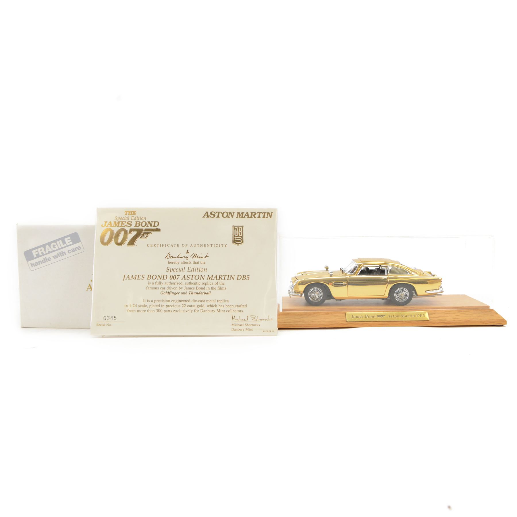 Danbury Mint Special Edition James Bond 007 22 carat gold plated 1:24 scale Aston Martin DB5, authentic replica of the car driven in Goldfinger and Thunderball, with certificate of authenticity, display case and original box