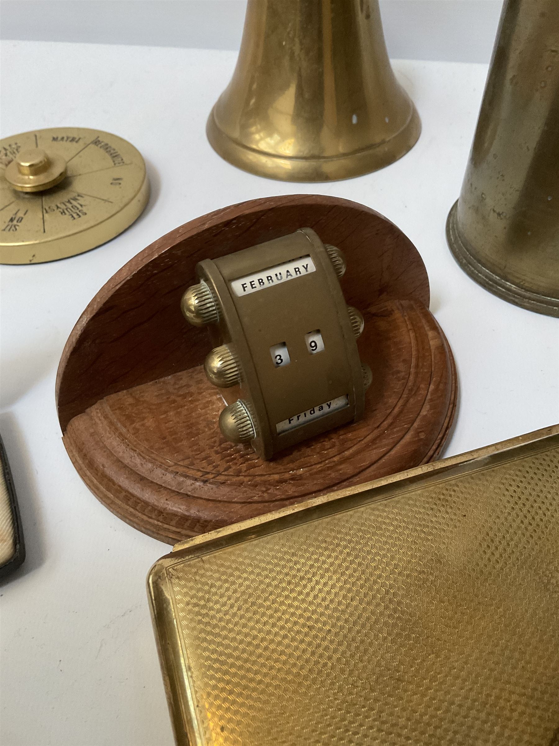 Quantity of brass to include Canadian 18 Pr. Mark II brass shell case,  Corinthian column candlestick with weighted base, perpetual desk calendar on wood base, engine turned cigarette cases and a quantity of metal table lighters etc