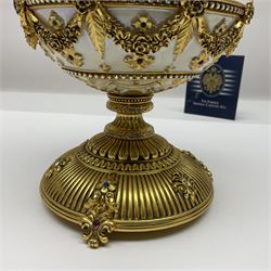 Franklin Mint House of Faberge; The Faberge Imperial Carousel Egg, with a carousel that revolves to the sound of the musical box operated by the winding key finial, H27cm