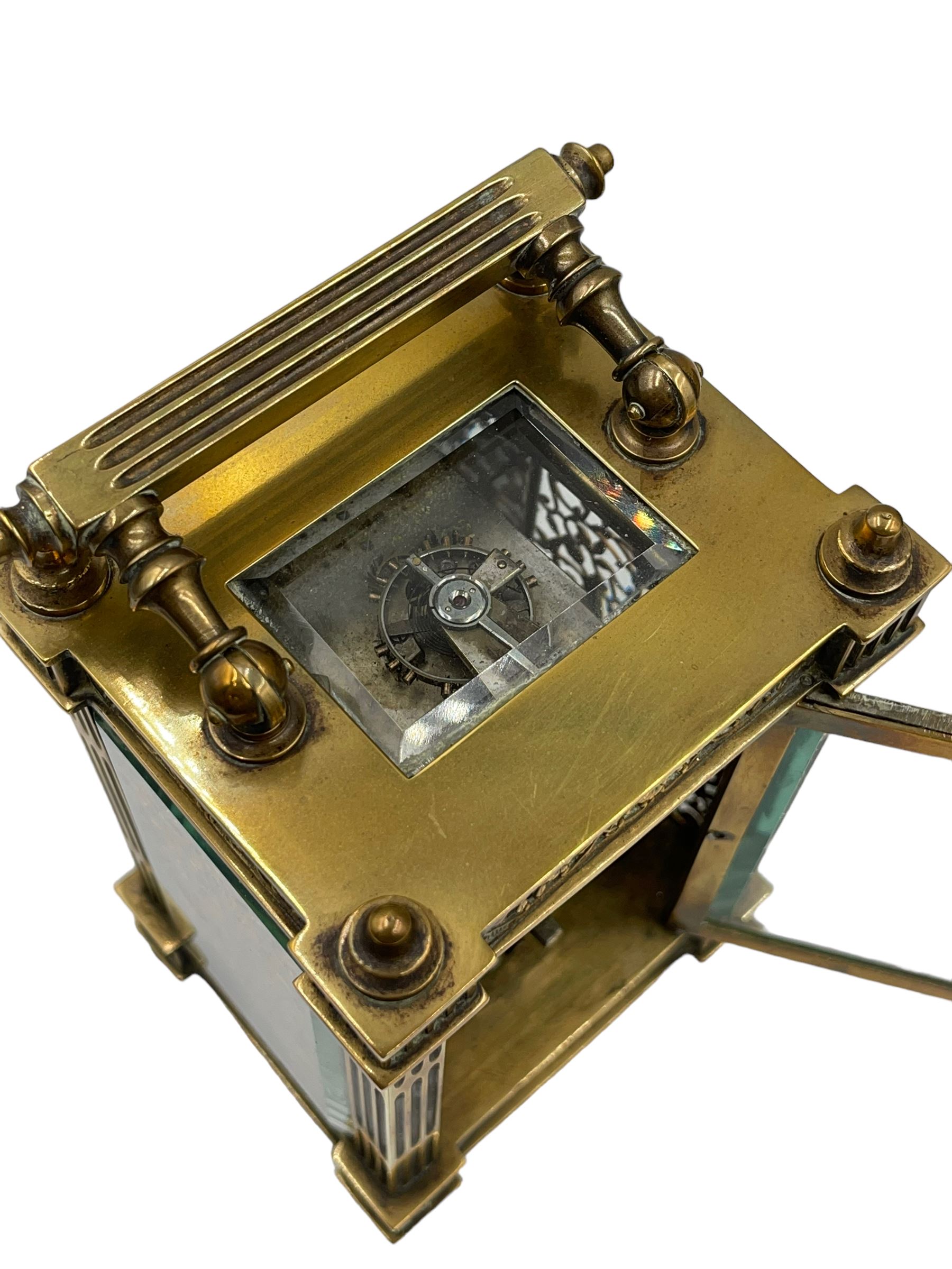 French - Matching pair of Edwardian 8-day timepiece carriage clocks with bevelled rectangular glass panels and overlaid friezes in gilt repousse work with fretted dial masks,  circular enamel chapter ring with Arabic numerals and steel spade hands, both clocks with single train movements, one movement with a jewelled cylinder platform escapement and the other with a jewelled and silvered lever platform escapement.
No Keys.