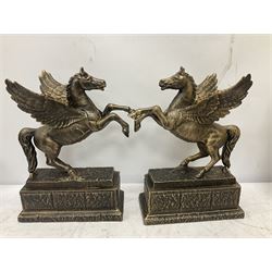 Pair of bronzed Pegasus, modelled in a rearing winged horse upon a plinth, H32cm 