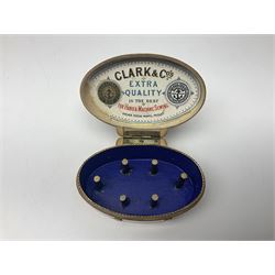Six sewing related Mauchline ware comprising an oval reel box with internal label for Clark & Co's, tape measure, pin case and three thimble holders of ovoid form 