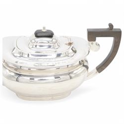 1920s silver tea pot, of oval bellied form, with Bakelite type handle and finial, hallmarked C W Fletcher & Son Ltd, Sheffield 1923, H15cm