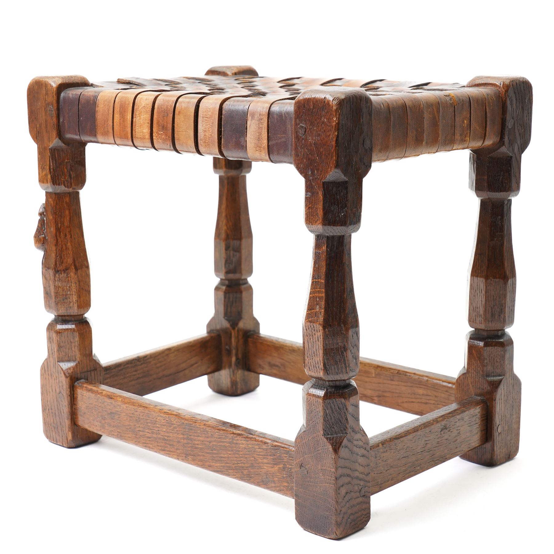 Mouseman - 1930s adzed oak joint stool, leather latticework seat on chamfered octagonal supports, carved with mouse signature, by Robert Thompson of Kilburn