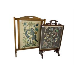 Mid-20th century oak fire screen with crewelwork panel with floral and animal designs (88cm x 69cm), and mid-20th century mahogany fire screen with shaped pediment and crewelwork panel depicting wild flowers (83cm x 57cm)