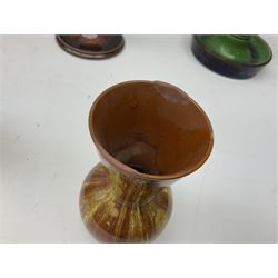 Linthorpe pottery vase with crimped rim and ovoid body, Linthorpe jug with high loop handle and crimped spout, a pair of candlesticks with a green, brown glaze and other similar pottery 