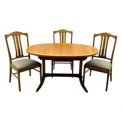 G-Plan - mid-20th century teak extending dining table, oval top with concealed central butterfly leaf extension, raised on splayed supports with cross-stretcher; three dining chairs with curved top rail and vertical splats