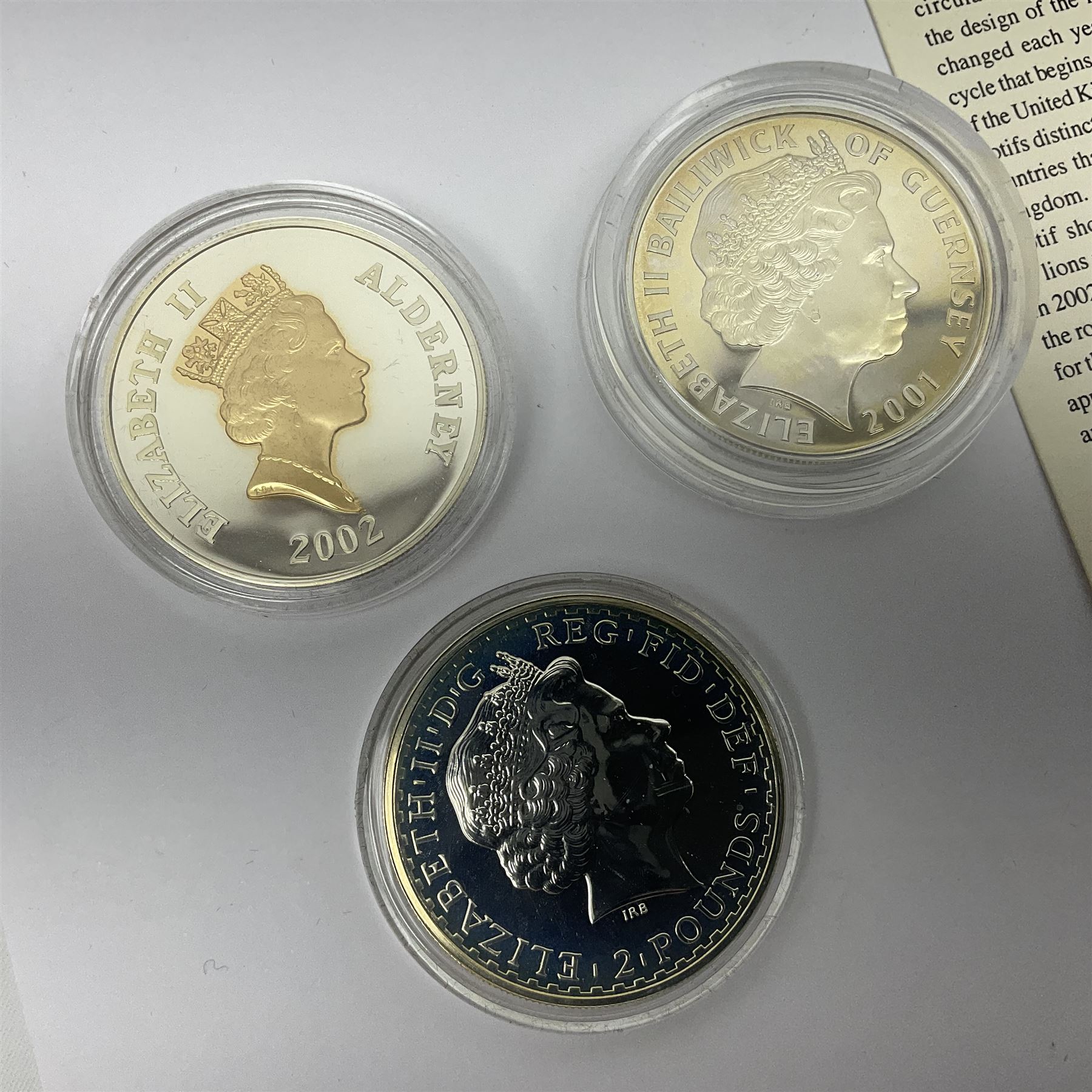 Thirteen silver coins, including Queen Elizabeth II Solomon Islands 2002 sterling silver five dollars, Alderney 2002 sterling silver five pounds, Fiji 2002 sterling silver ten dollars, United Kingdom 2003 one ounce fine silver Britannia, 2003 'Give Women The Vote' fifty pence etc, all with some form of certificate