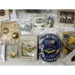 American patches and badges, including para wings, USS Constellation, Strategic Air Command, U.S. military academy, health service regt, Navy Seals, Air Defence Command, Seventh Fleet, various collar badges etc