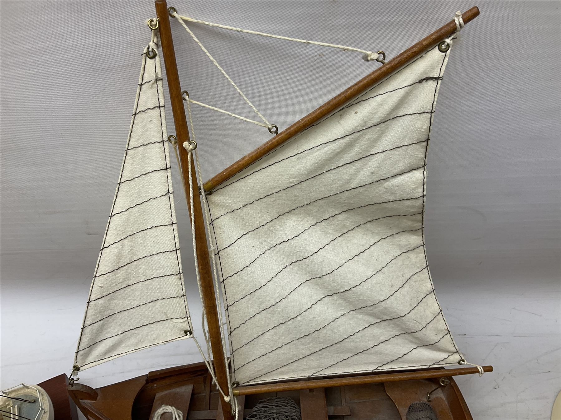 Nautical themed decorative items, to include Titanic book ends, model boat, books, lighthouse lamp etc in one box