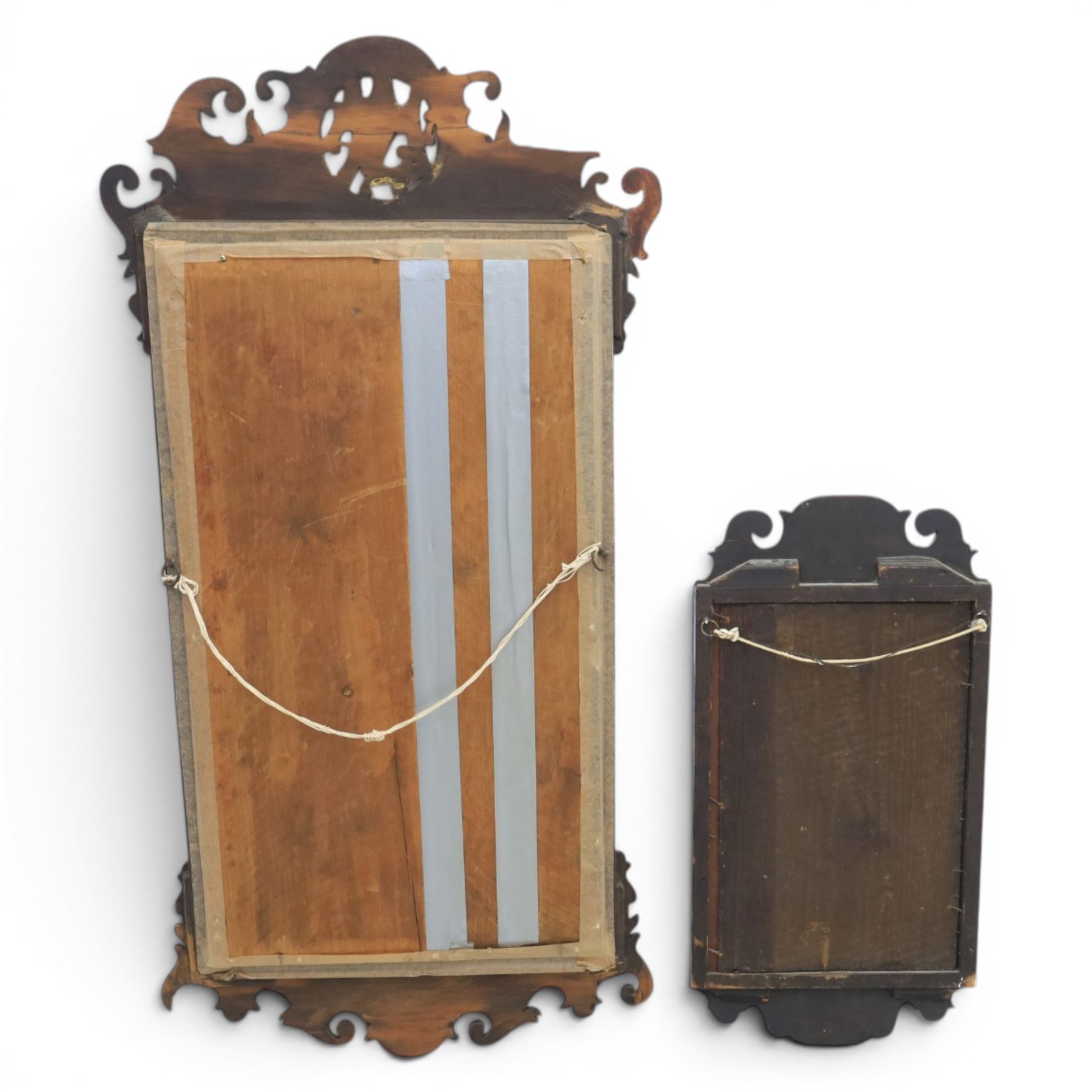 Late 19th century Chippendale style mahogany wall mirror, featuring gilded eagle pediment; together with a smaller similar mirror