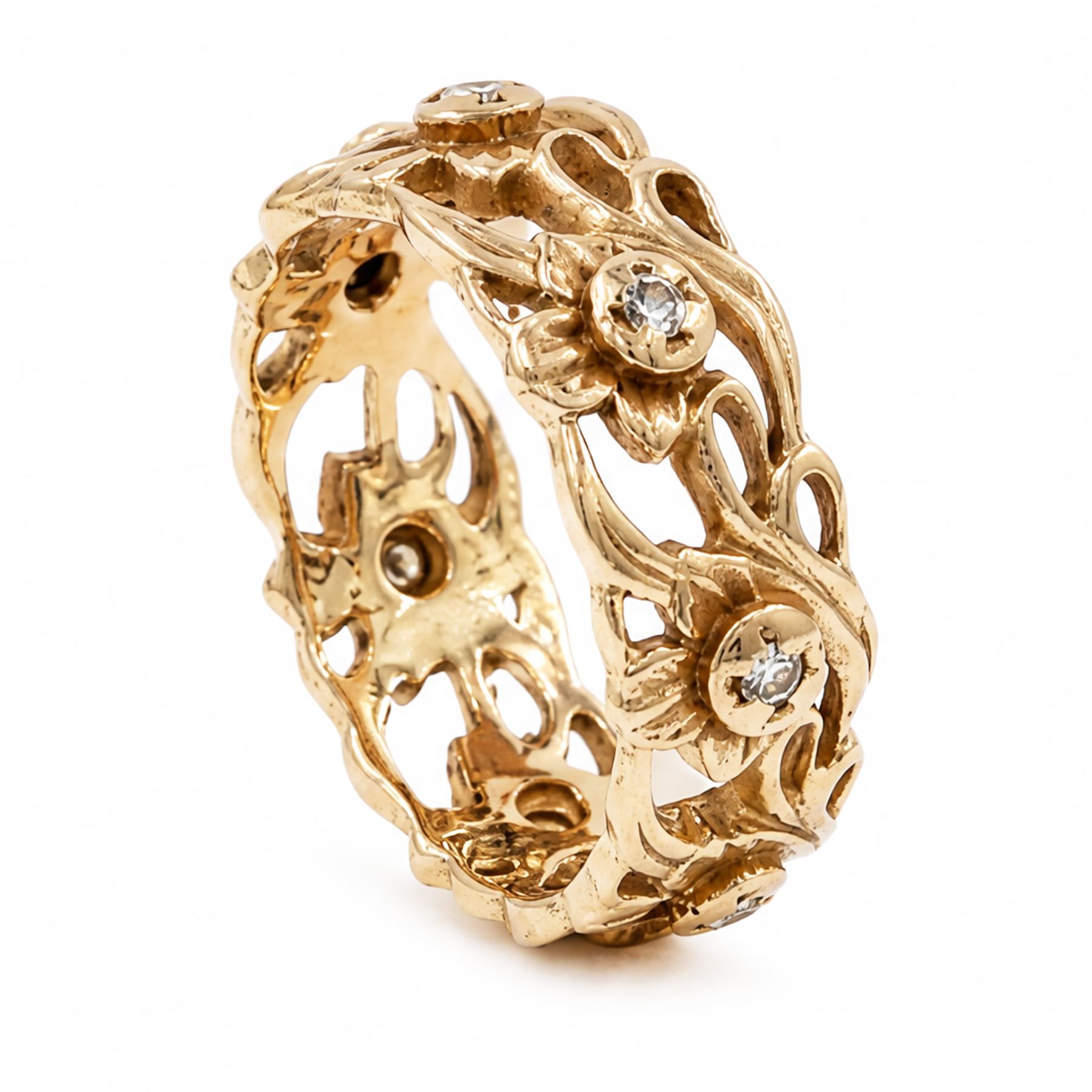 14ct rose gold diamond set band, pierced floral band set with seven round brilliant cut diamonds, stamped 14k