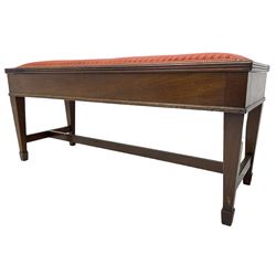 Early 20th century mahogany piano duet stool, hinged top  enclosing compartment with sheet music,seat upholstered in striped crimson fabric, reeded edge, on square tapering supports with spade feet
