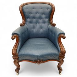 Fine pair of mid-19th-century mahogany library armchairs, carved frame with balloon-shaped back with scrolled ends, rolled wide arms, ending in a scrolled volute above a serpentine seat rail, upholstered in mottled turquoise faux leather, button upholstered back, arms, and cushion seat, studded sides and apron, raised on scroll carved front feet and splayed rear legs on castors 