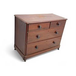Victorian 19th century stained pine chest of drawers, rectangular top above two short and three long drawers with turned wooden handles, raised on bun feet with castors.