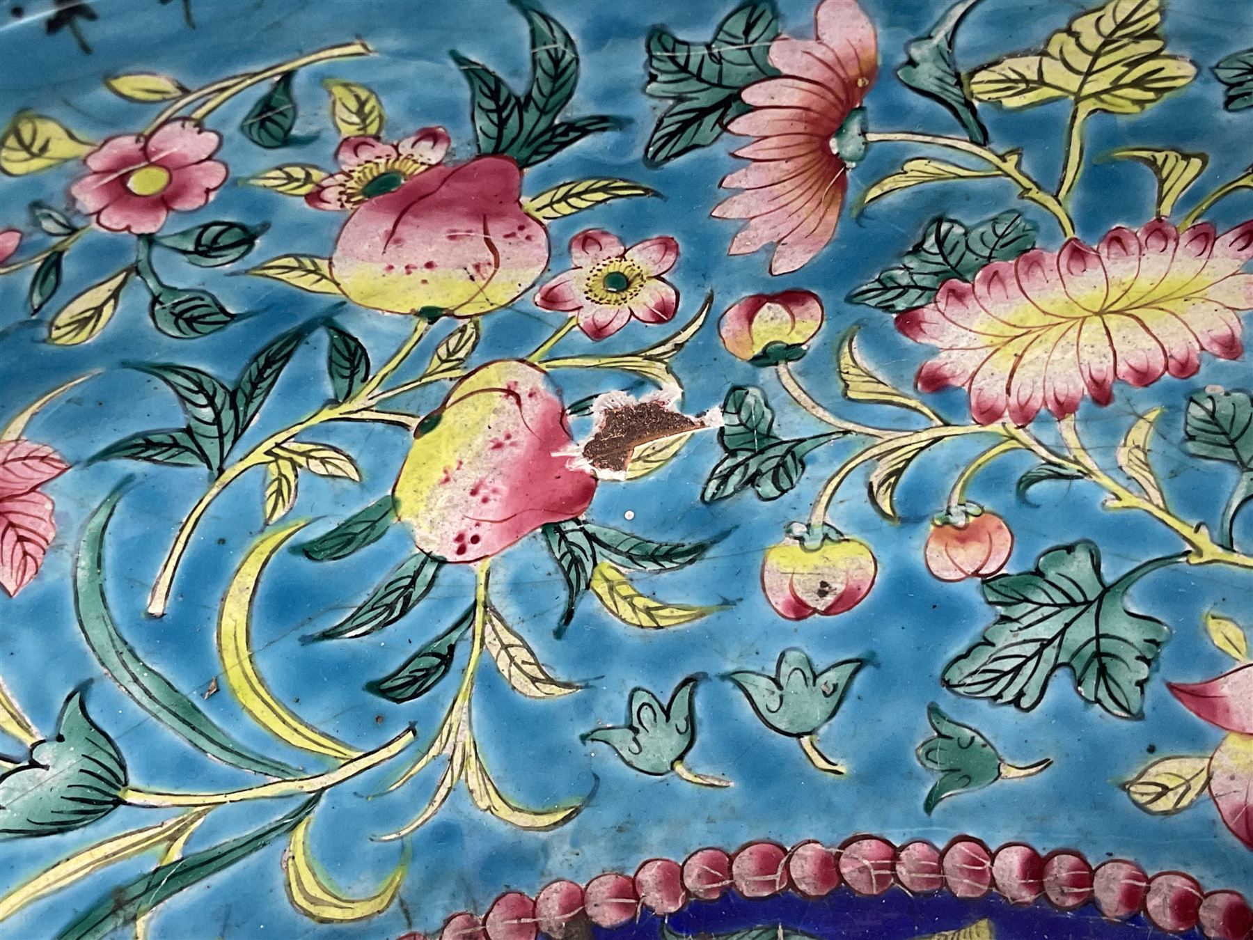 18th/19th century Chinese Canton enamel basin, the circular basin with flat everted rim, decorated with scrolling foliate and fruit decoration on a blue ground, D43cm