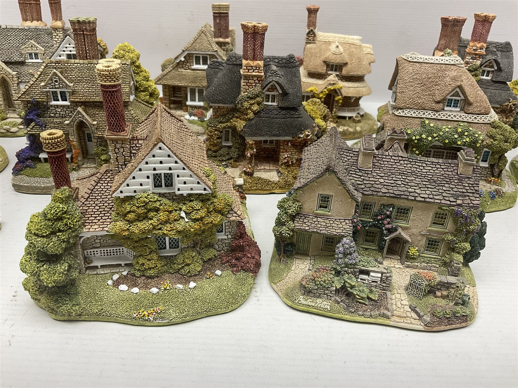 Eight Lilliput Lane limited edition Beatrix Potter models, including Buckle Yeat, Tabitha Twitchits Shop and Ginger Pickles Shop, together with twelve Lilliput Lane models from the Blaise Hamlet collection, including Dial Cottage, Diamond Cottage and Vine Cottage, all with deeds and original boxes (20)
