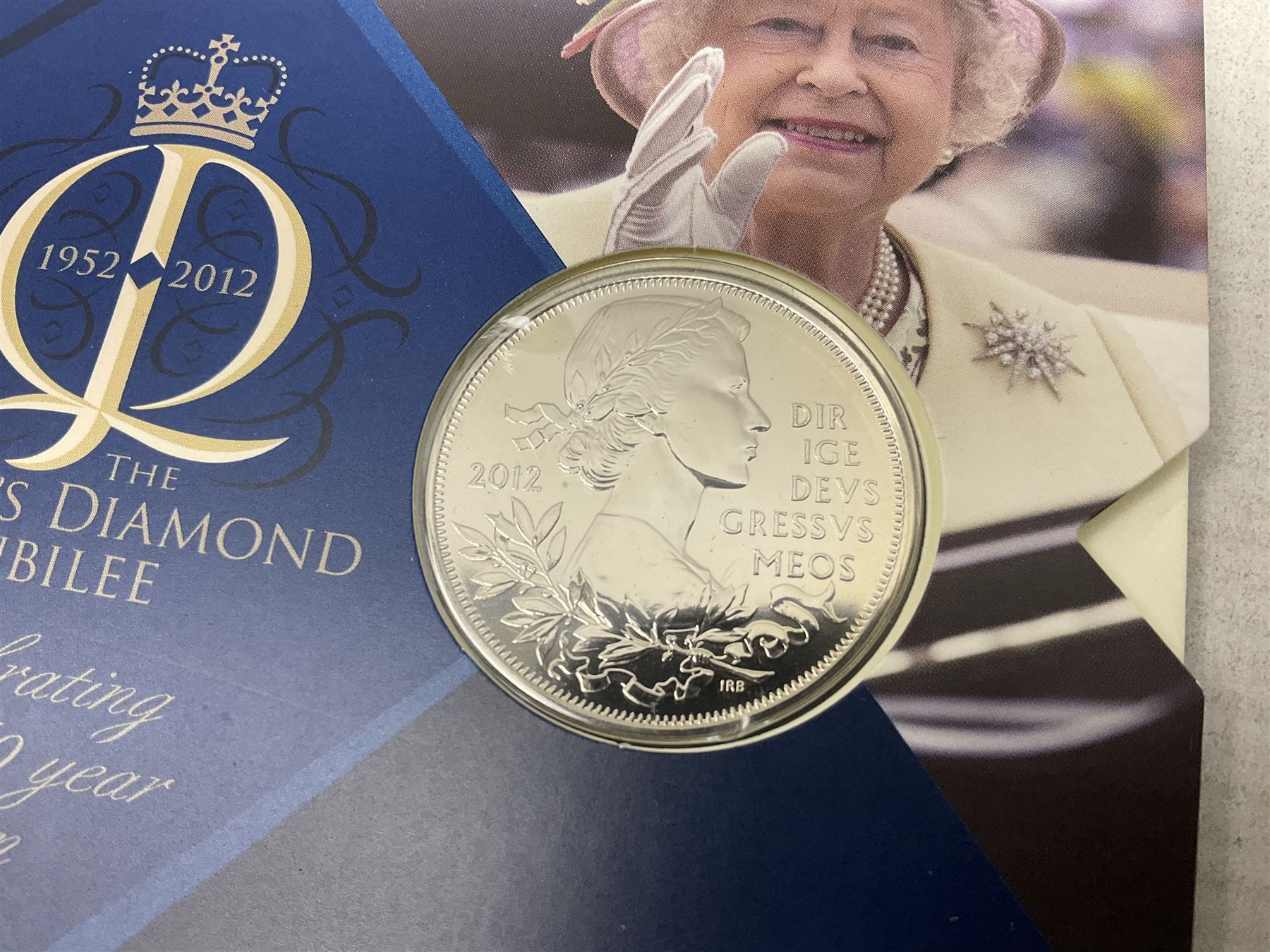 Coins and sets, including Great Britain and Northern Ireland 1970 proof coin collection in card folder, Queen Elizabeth II 2021 'Through the Looking Glass' five pounds, 2021 'Winnie the Pooh' fifty pence, Queen Victoria 1887 halfcrown, King George V 1914 halfcrown, commemorative coins, The Royal Mint Solomon Islands 2003 twenty-five dollars silver proof coin cased with certificate, 9ct gold half sovereign mount etc