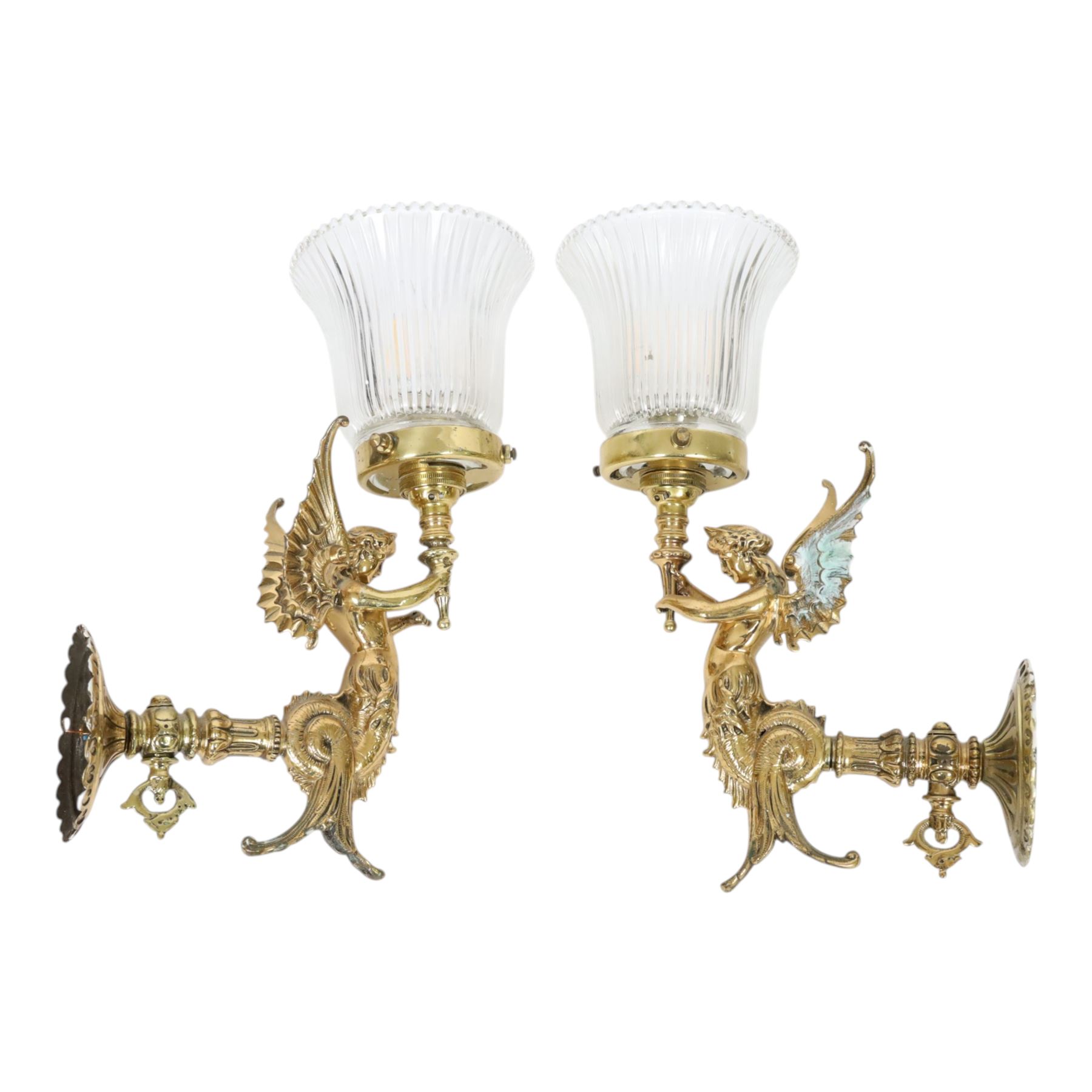 Pair of Victorian style wall sconces, each modelled as a caryatid supporting a single light fitting in one raised arm, with tapering and fluted clear glass shade, approximately H31cm D21cm