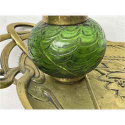 Art Nouveau Geschutzt brass desk stand, with stylised whiplash relief decoration, with removable Loetz style green glass inkwell, stamped to the base, H8cm