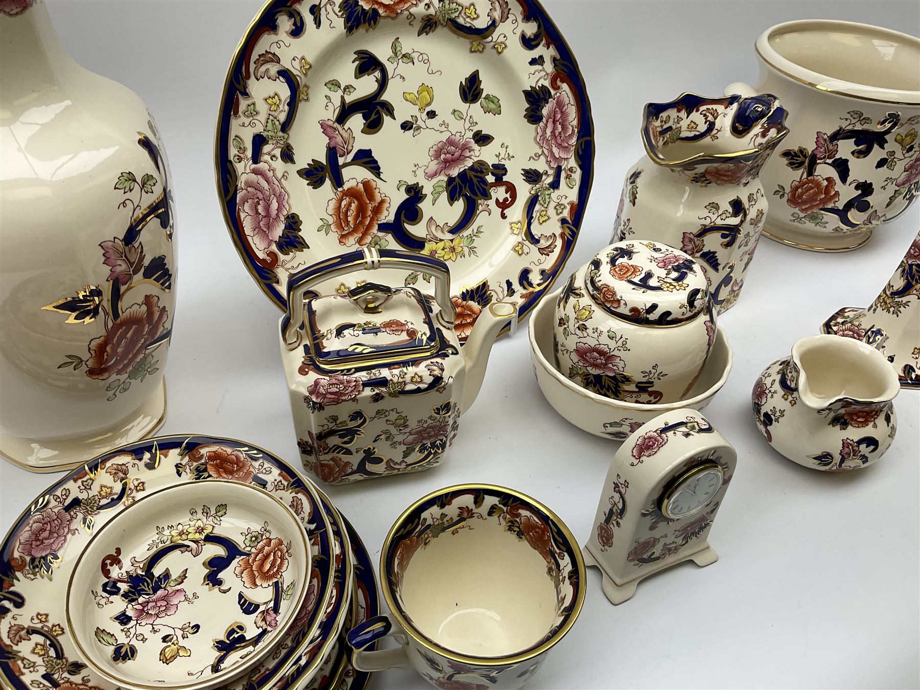 A group of Masons Ironstone Mandalay pattern wares, comprising large vase, planter with twin lug handles, three graduated plates, bowl, teapot, teacup and saucer, jug, smaller jug, open sucrier, small pot and cover, pair of candlesticks, small mantel clock, and pin dish. 