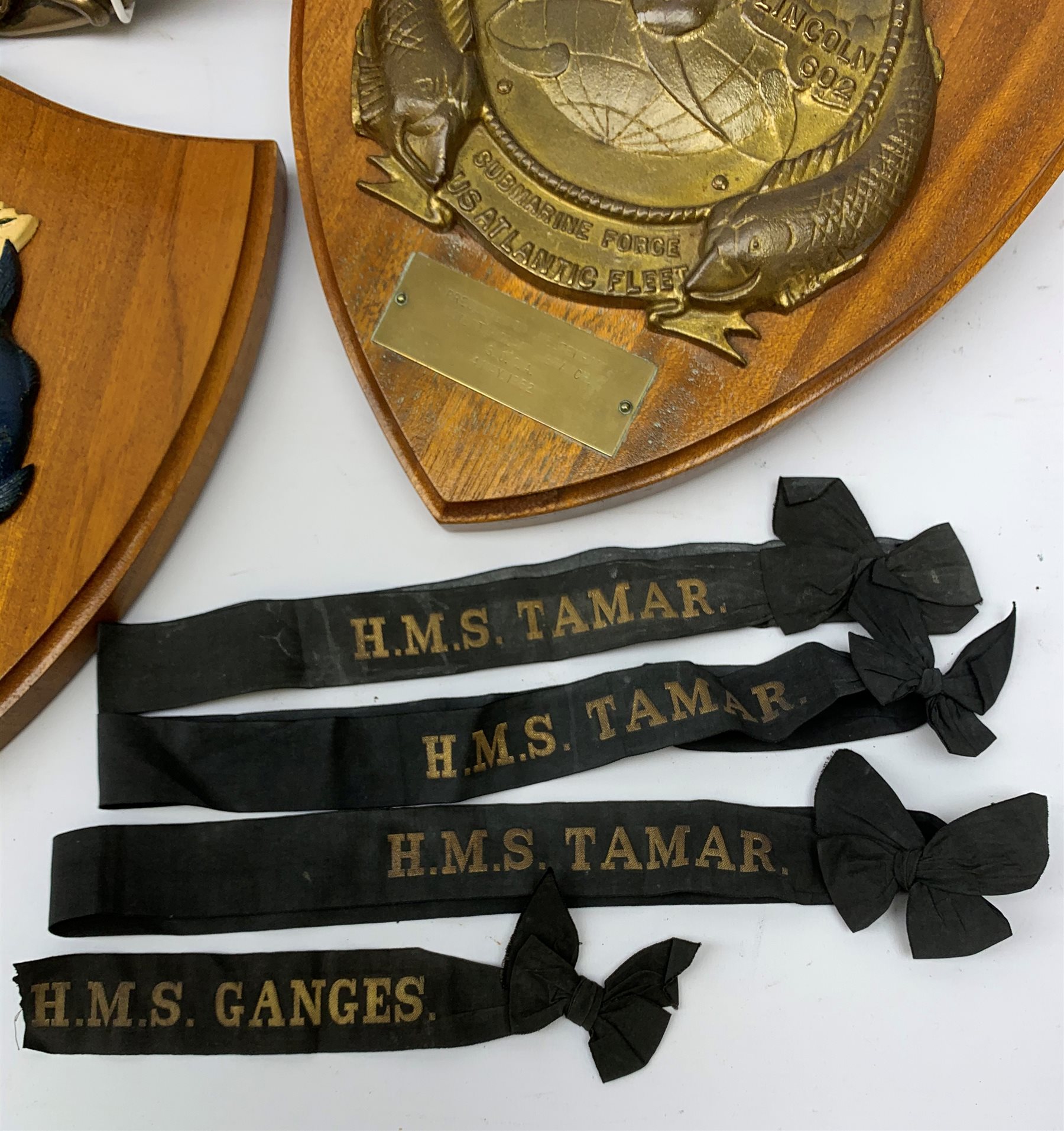  Two Submarine Force US Atlantic Fleet presentation plaques, the first detailed Subron 14, the second USS Abraham Lincoln 602, each H32.5cm, together with five uniform patches, four cap tallies, detailed HSM Tamar (x3), and HMS Ganges, and a set of two limited edition Euro Tunnel commemorative presentation plaques, The Breakthrough 1st December 1990 and Celebration 6th May 1994, D27cm, complete with original certificates.  