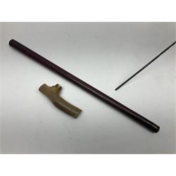 Victorian magician's cane, the mahogany walking stick twisting apart to reveal an internal mechanism, opening to tripod and black silk fold out magician's table, with horn handle and silver mount, hallmarked Birmingham 1891