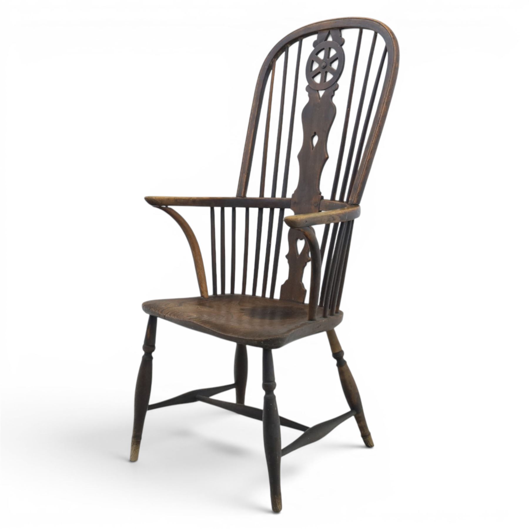 19th century Provincial wheelback Windsor armchair, high stick back, saddle seat on four turned legs with H-stretchers