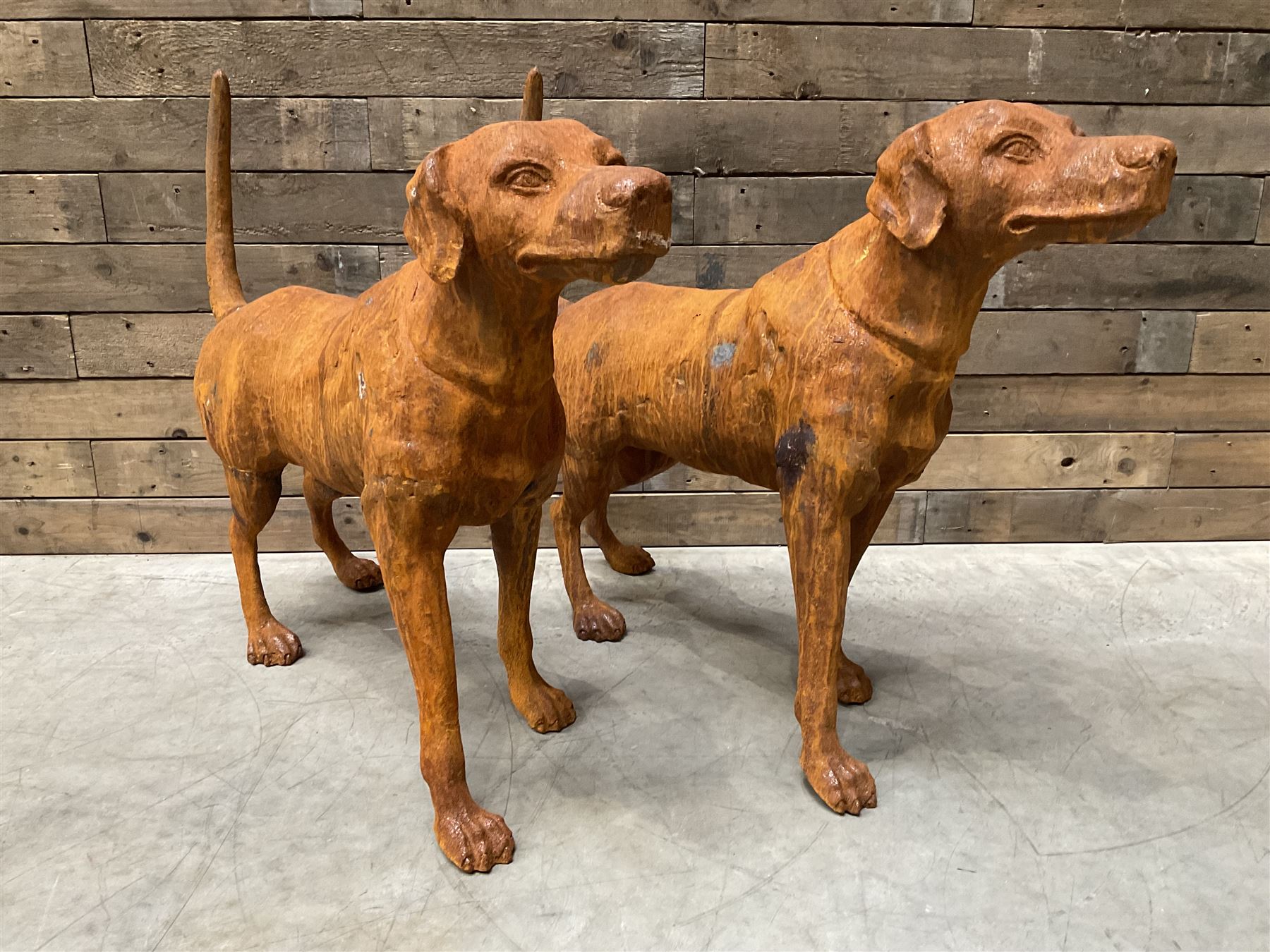Pair of life-size heavy cast iron garden Hunting dogs