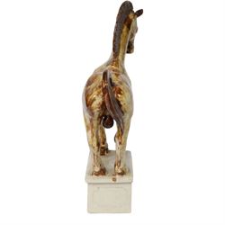 Owen Thorpe, studio pottery horse, standing with one leg raised, upon a rectangular plinth, H35cm 