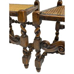 Set six 19th century oak Carolean style dining chairs, the cresting rail with open crown flanked by putto, spiral turned uprights with pineapple finials, canework seat and back, the seat rails carved with foliage, spiral turned supports joined by s-scroll and open crown carved front rail, decorated with flower heads, each with upholstered seat pad