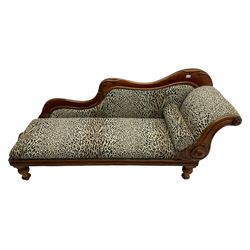 Victorian mahogany framed chaise longue, shaped arm carved with acanthus leaves, the scrolled back with applied carved rosettes,upholstered in monochrome leopard print fabric with bolster cushion, raised on turned supports