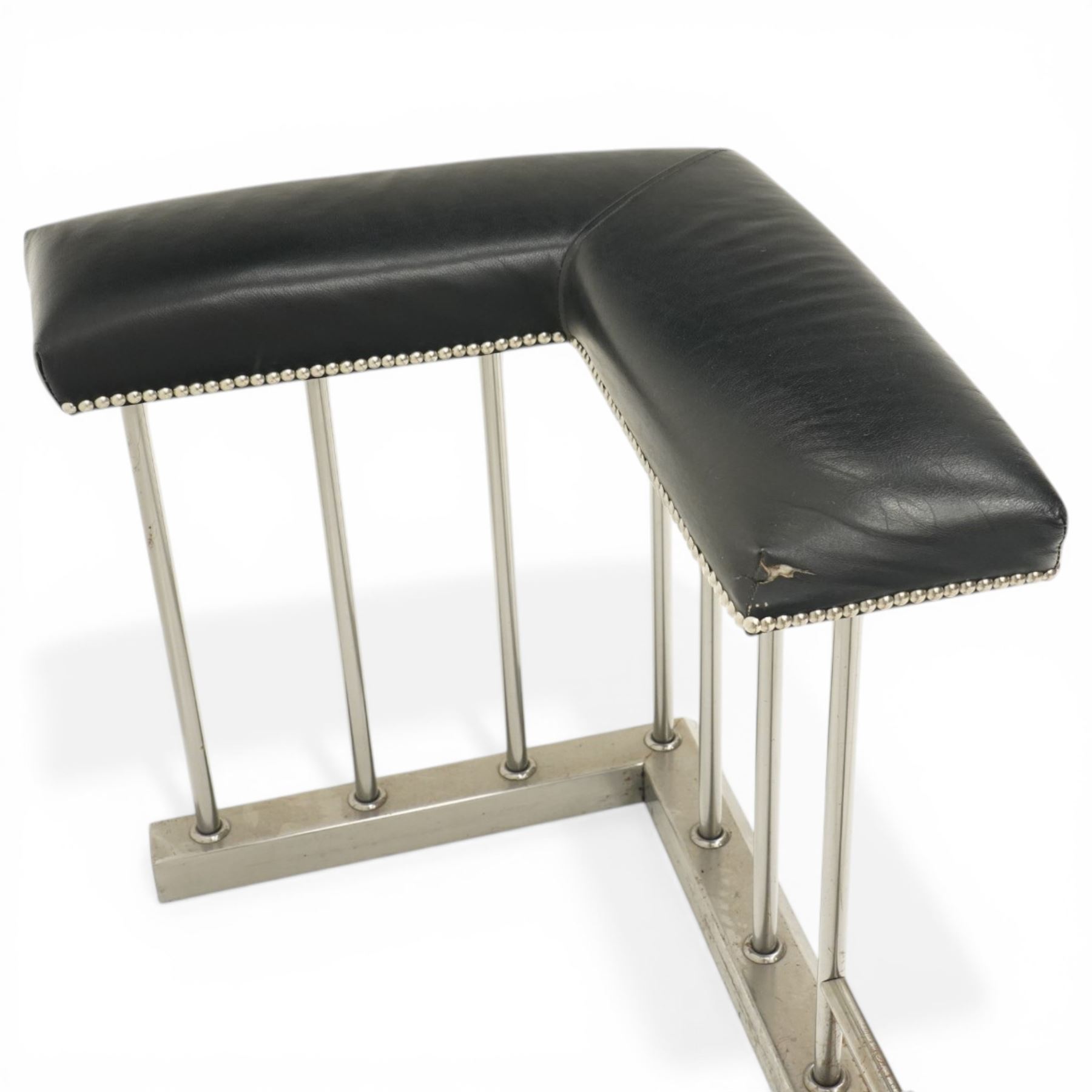 20th century steel club fender, with black leather seats above a steel frame