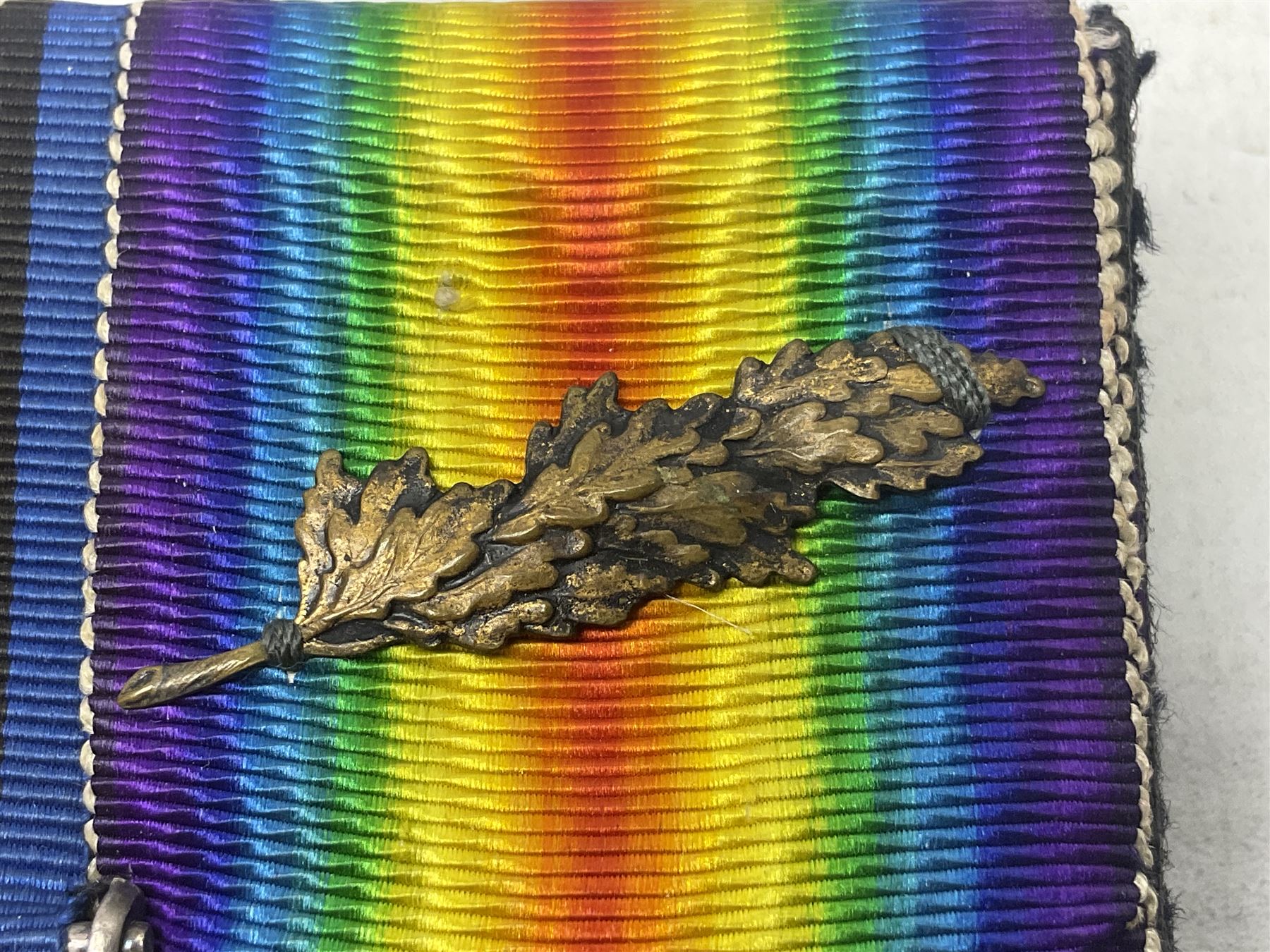 WW1 group of three medals comprising 1914-15 Star awarded to 536 Pte. T. Hall North'd Yeo. and British War Medal and Victory Medal with oak leaves awarded to 2.Lieut. T. Hall; with ribbons; displayed on board for wearing; some biographical details