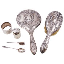 Early 20th century silver matching hand mirror and hair brush, each decorated in relief with bows united by floral swags, hallmarked William Adams Ltd, Birmingham 1913, together with a German silver napkin ring, engraved with monogram, stamped 800 with crescent and crown mark, silver topped cut glass jar and two silver spoons