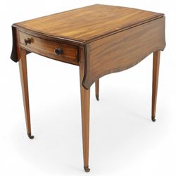 Goergian small butterfly pembroke table, the rectangular top with crossbanded edge and rounded drop leaves, single frieze drawer with opposing dummy drawer, raised on square tapering legs with stringing, terminating in brass castors