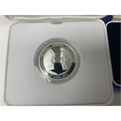 The Royal Mint United Kingdom 2000 'Millennium' silver proof five pound coin and 2011 'The Royal Wedding' silver proof piedfort five pound coin, both cased with certificates