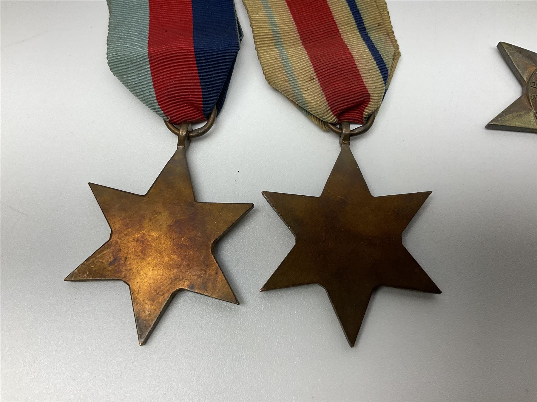 Eleven WW2 medals comprising three 1939-1945 war medals, two Defence medals, three 1939-1945 Stars, Atlantic Star, Africa Star and Italy Star; miniature QEII Naval LS & GC medal; all with ribbons; and WW2 postumous medal slip to Flight Sergeant L.N. Clark