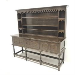 Early 20th century oak dresser, raised single tier plate rack, projecting cornice, three drawers, baluster supports joined by square stretchers Height: 174cm  Length/Width: 183cm  Depth/Diameter: 55cm