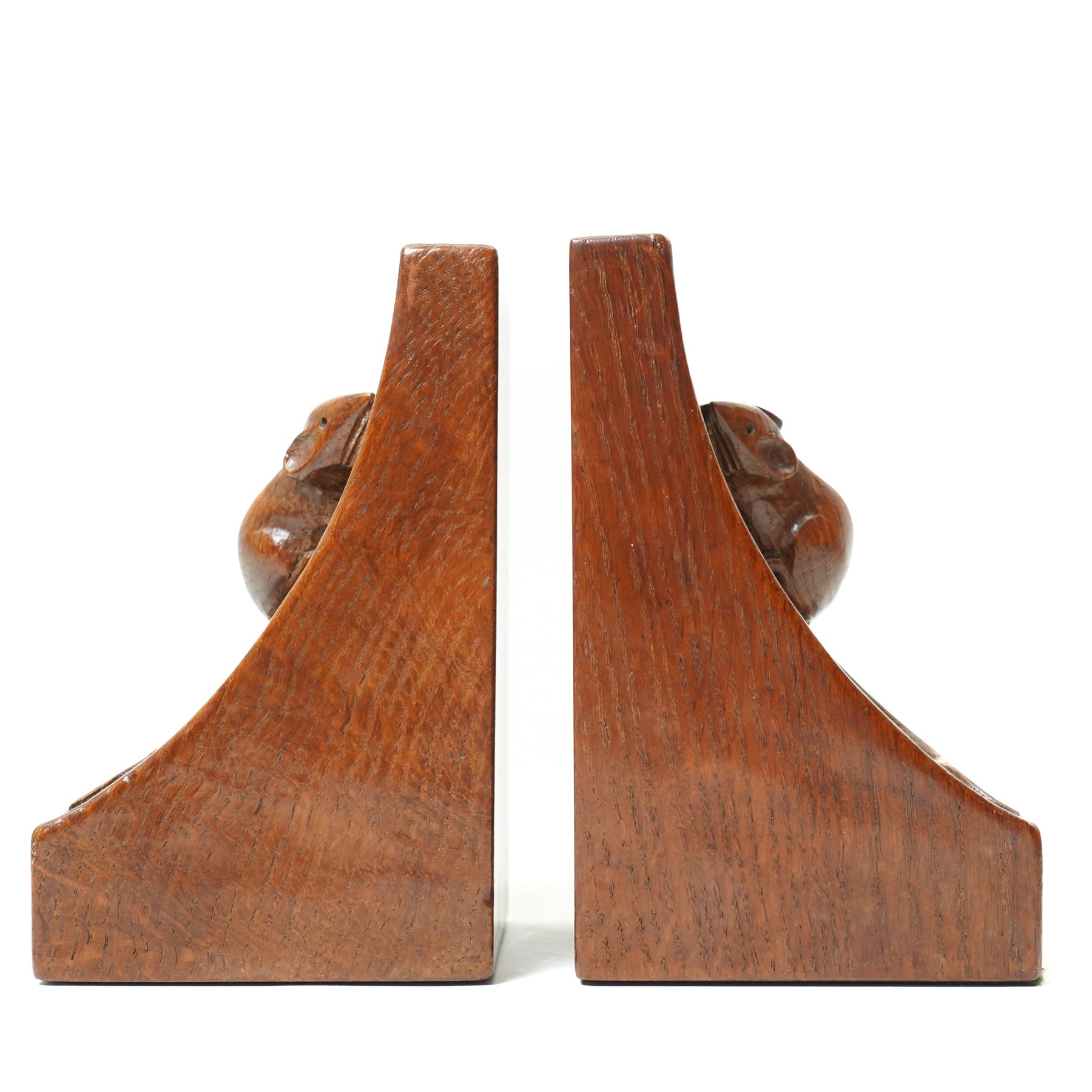 Mouseman - pair of circa 1940s/50s oak bookends, good colour, with carved mouse signatures forming a heart shape when side by side, by Robert Thompson of Kilburn