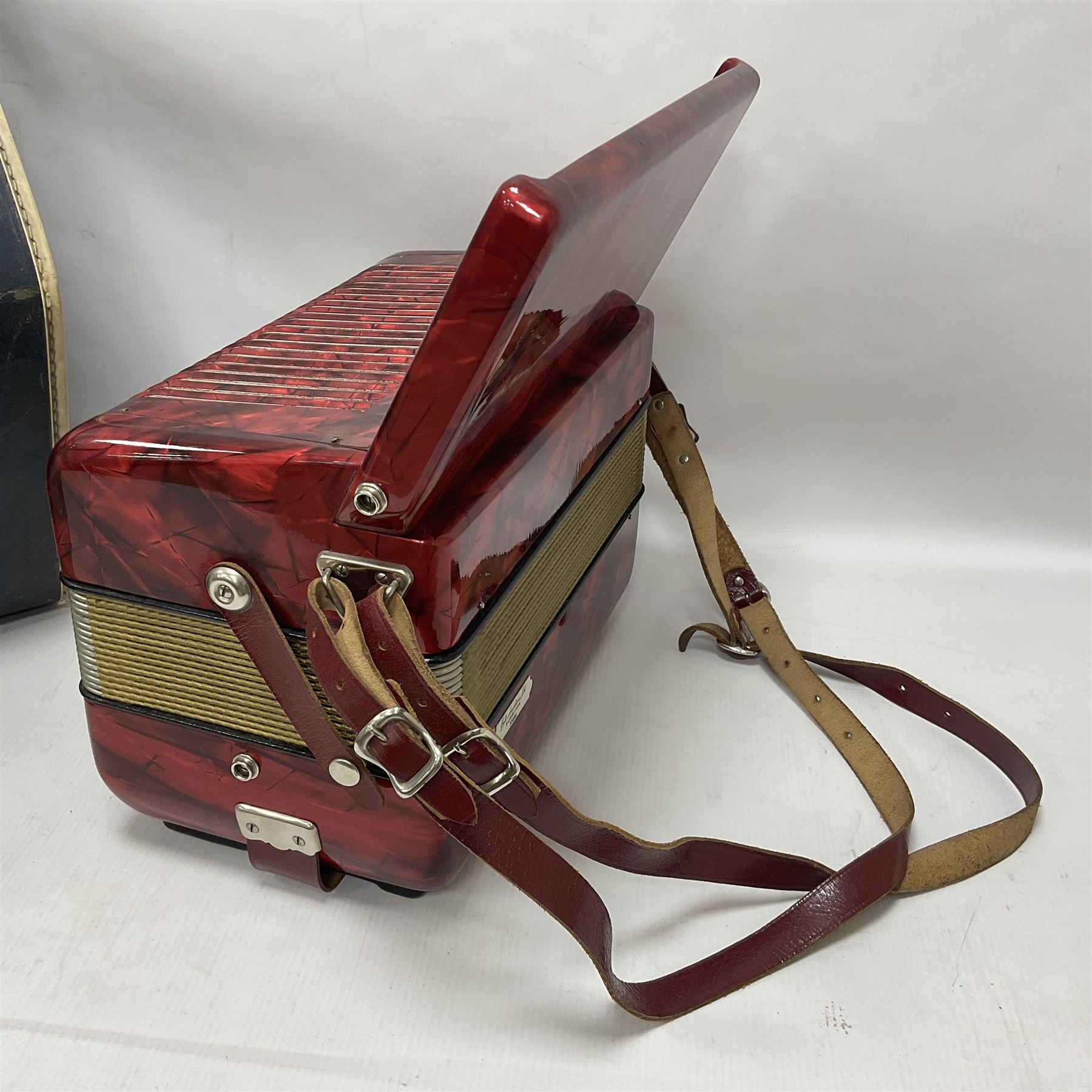 German Hohner student II compact accordion with 26 keys and 12 bass registers in a hard case With tutor