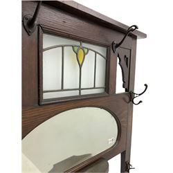 Edwardian oak hallstand, fitted with leaded glazed panel, six coat hooks, mirror, trinket drawer and two stick stands, W1cm, H200cm, D28cm
